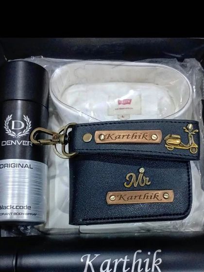 A coordinated gift set with a Levi's shirt, personalized wallet, keychain, and a name-engraved flask.