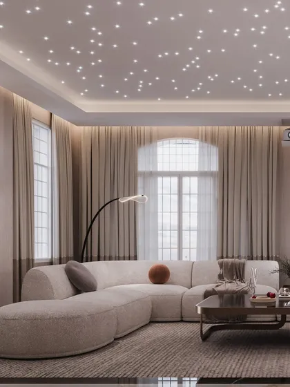 A luxurious cinema room in a London home, featuring a large, comfortable sectional sofa under a magical starlight ceiling.