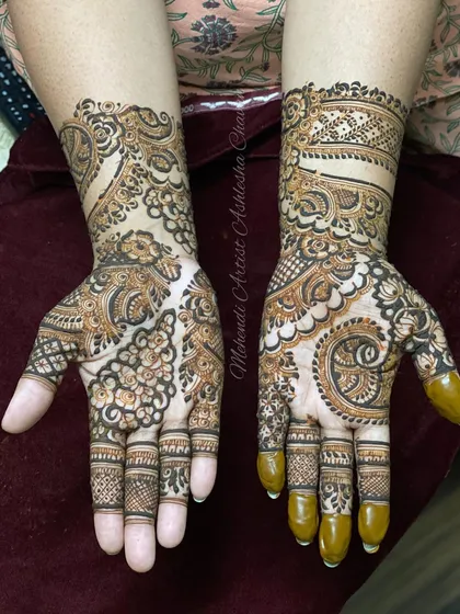 An Indo-Arabic design with a mix of bold and fine lines. The patterns are intricate and create a rich, textured look.