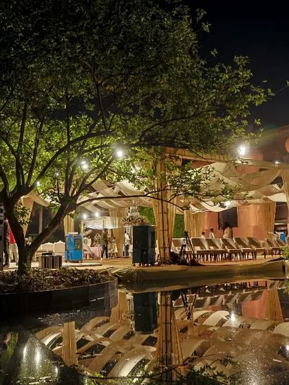 The resort transforms at night into a beautifully lit venue, perfect for hosting special events like weddings, with the water bodies providing a stunning backdrop.