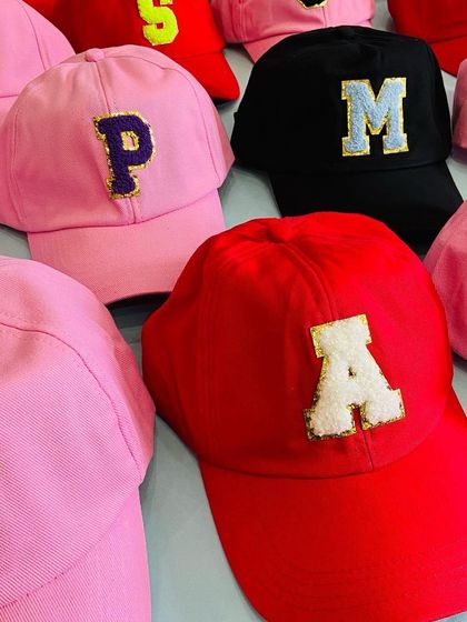 More examples of our popular initial caps, perfect for personalizing as party favors. This image shows a mix of bright and classic colors to suit any party theme.