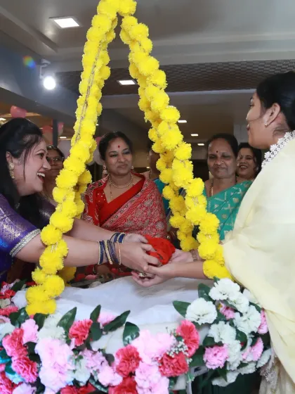 Family members participating in the cradle ceremony, a beautiful tradition filled with smiles and community spirit.