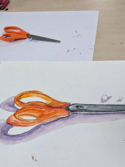 A detailed watercolor study of a pair of scissors. This exercise challenges students to accurately render the different materials of plastic and metal, focusing on highlights, shadows, and reflections.