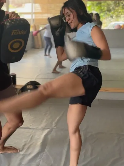 Another action shot of a powerful kick connecting with the pads.