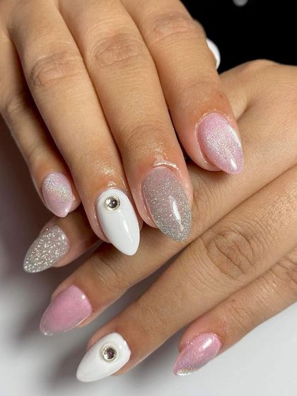 A cute and playful set with pink glitter, white, and rhinestone accents. This is a fun design for clients who love sparkle.