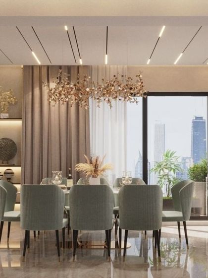 This bright and airy dining room in a Lucknow residence is perfect for family meals and entertaining. We used light-colored seating, a contemporary chandelier, and a large window to create a space that feels open, luxurious, and connected to the city view.