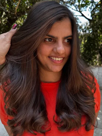 A simple highlight refresh can make a world of difference. I brightened up her existing color and gave her a fresh style, making her hair look vibrant and healthy again.