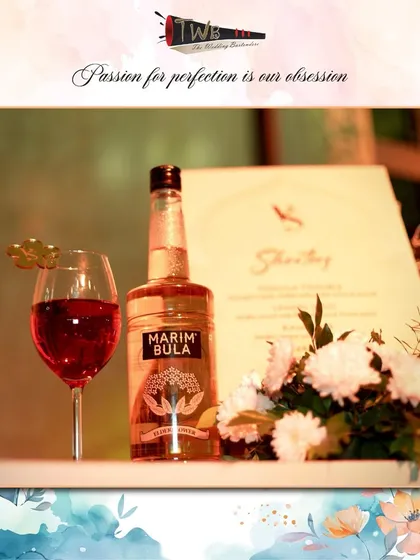 A beautifully crafted cocktail featuring a delicate floral garnish, showcasing our attention to detail and commitment to elegant presentation.