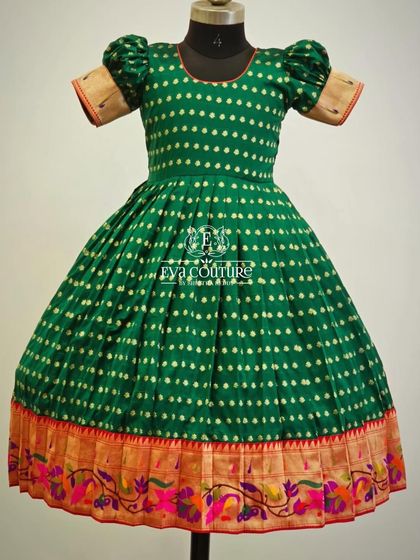 A classic frock made from green Ikat fabric. The puff sleeves and colorful Paithani border give it a traditional yet playful feel.