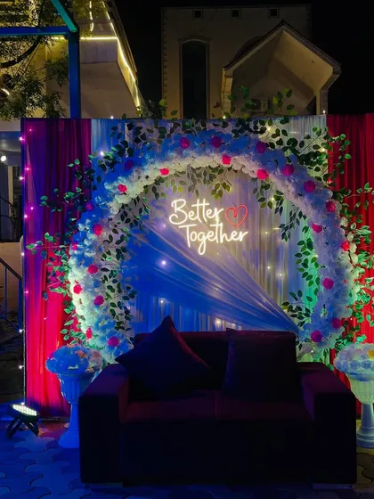The decoration at night, with fairy lights and spotlights creating a magical effect.