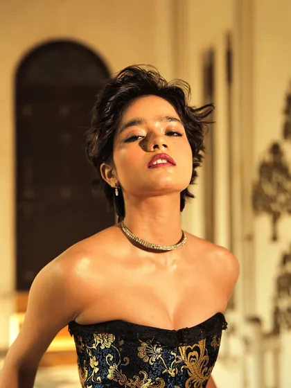 I call this the 'dewy glam' look. It is all about creating that lit from within glow that catches the light beautifully. The skin is luminous, the eyes are defined, and the short, textured hair adds a touch of modern edge.