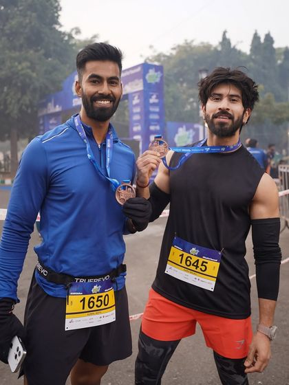 Two of our members celebrating their achievement at the Dilli 10K run. This is what our community is all about: setting goals and crushing them together.