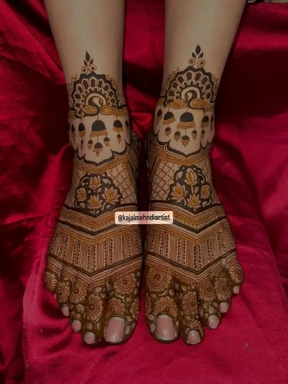 A top-down view of the peacock and bells leg design.