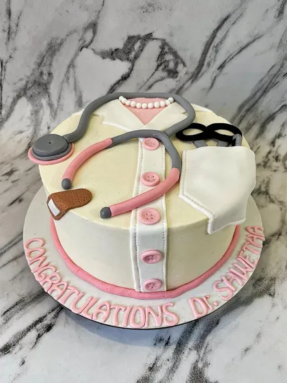An apple a day keeps the doctor away, but a doctor cake is for a special day! I designed this cake to look like a doctor's coat, complete with a fondant stethoscope, to celebrate a medical school graduation.