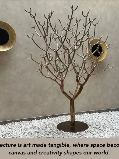 "Architecture is art made tangible." This image, featuring a sculptural art piece, embodies our philosophy. We believe in creating spaces where art and nature are harmoniously fused, enhancing the ambiance with beauty and organic charm.