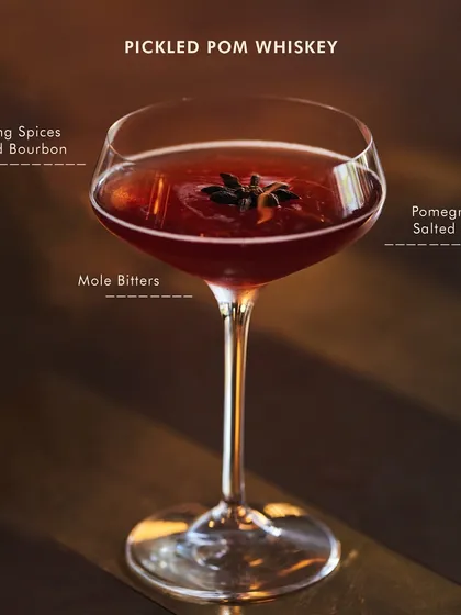 Meet our bestselling Pickled Pom Whiskey. We infuse bourbon with our own pickling spice and mix it with a pomegranate shrub for a drink that's tangy, a little spicy, and loaded with attitude.