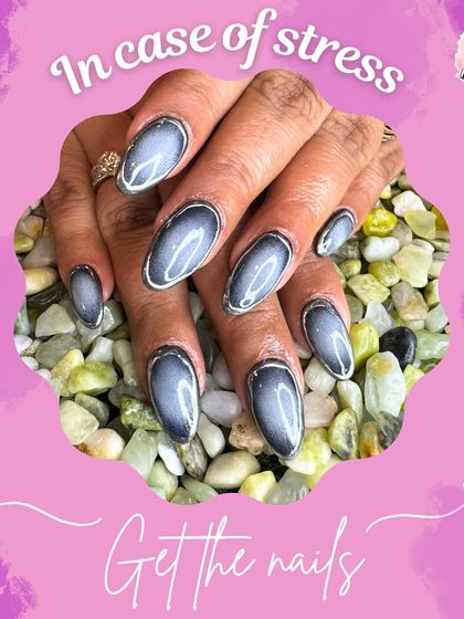 My stress relief mantra: get your nails done. This sleek and moody set features a dark grey cat eye effect that's both sophisticated and mesmerizing.