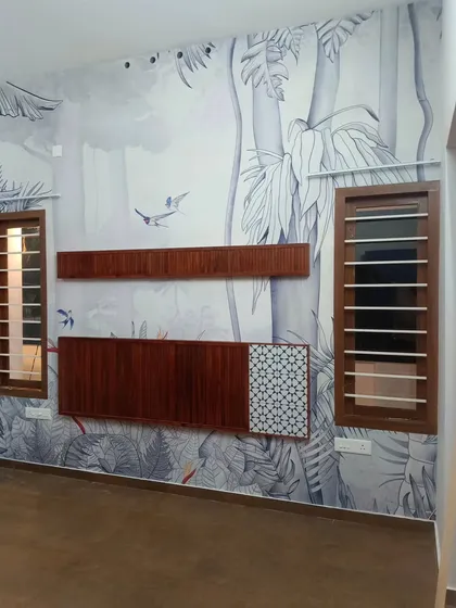 I designed this monochrome jungle mural to integrate with the room's wooden TV unit. The result is a cohesive and stylish entertainment wall that feels both natural and modern.