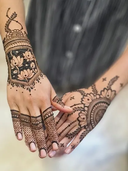 A unique design featuring a lotus-filled frame on one hand and a mandala on the other.