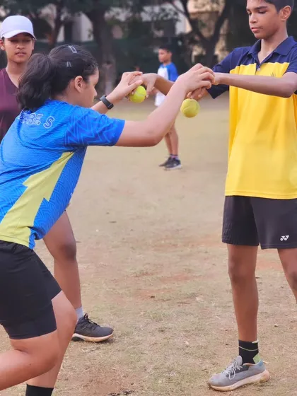 This partner drill using tennis balls improves hand-eye coordination, reaction time, and agility, all vital skills for badminton.