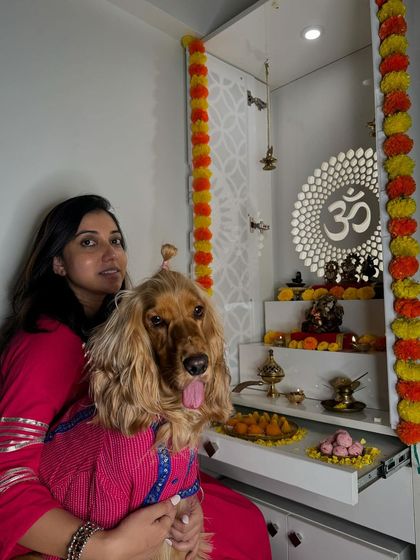 A mother-son portrait during Ganesh Chaturthi, with our home decorated for the festival.