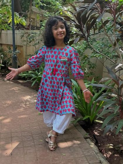 An essential staple in a girl's wardrobe is an outfit she feels comfortable in. This strawberry print kurta set is perfect for that, allowing her to play and be herself with ease.