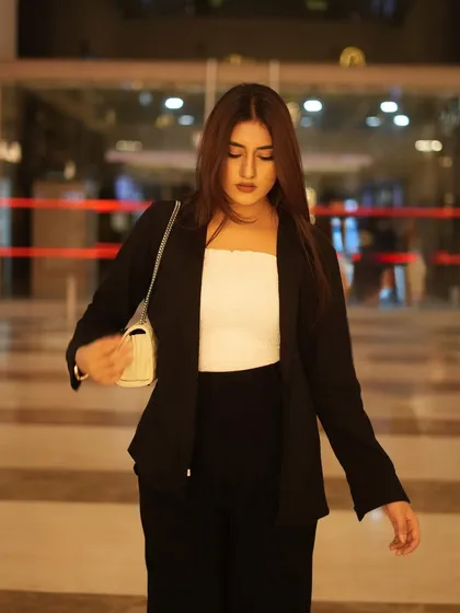 Adjusting my bag, a candid shot that still looks polished.