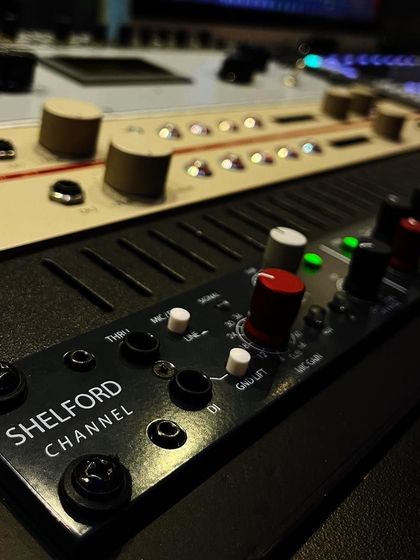 Another angle of the Rupert Neve Designs Shelford Channel integrated into our studio desk. This is professional-grade analog processing at your fingertips.
