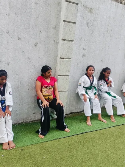The wall sit is a simple but brutal exercise for building leg strength and endurance. Our students hold this pose to develop the powerful base needed for stable stances and kicks.