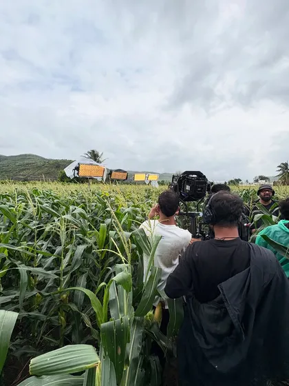 A wide shot of an outdoor shoot in a cornfield, where we used a line of ARRI SkyPanel X fixtures to supplement the natural light and create a specific mood.