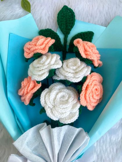 A top-down view of the lovely peach and white crochet rose bouquet. This angle shows the beautiful arrangement and the detailed craftsmanship of each handmade flower.