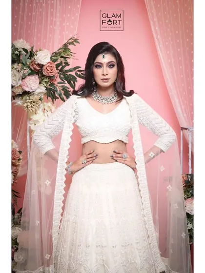 A powerful and confident pose. The makeup enhances the model's strong features, creating a high-fashion, editorial feel.