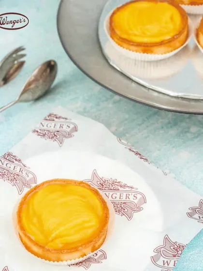 This is our much-loved Peach Tart. A crisp, buttery pastry shell filled with a sweet and tangy peach compote, it is a simple and elegant dessert that has become a favourite for many of our customers.