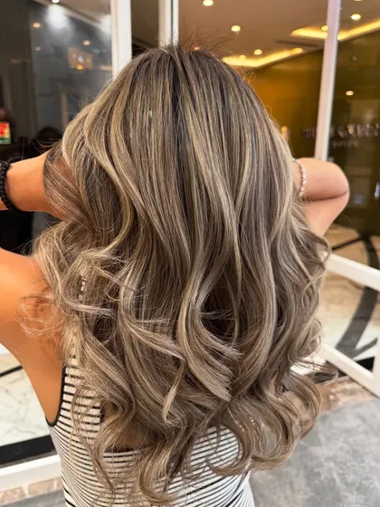 Another angle of the ash blond balayage, highlighting the beautiful, smoky tones.