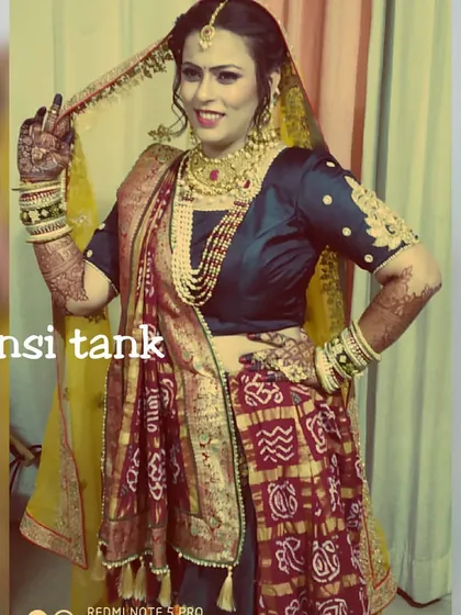 A happy bride in her beautiful Panetar saree. I gave her a classic bridal makeup look with a pearl-lined hairstyle to match her traditional Gujarati wedding attire.