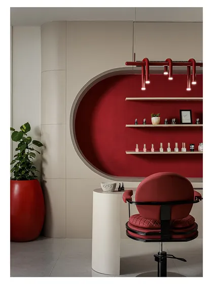 This is the manicure and pedicure station, designed as a focal point. The circular niche, finished in a rich red fabric, creates a cozy and private feel, while the custom overhead lighting provides perfect illumination for detailed work.