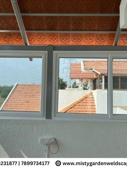 A detailed look at the sliding UPVC windows installed in a terrace room. These windows are easy to operate, durable, and provide excellent weather protection.