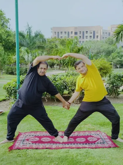 It's wonderful to see students of all ages and backgrounds enjoying partner yoga in the park. This pose creates a beautiful shape while stretching the sides of the body.