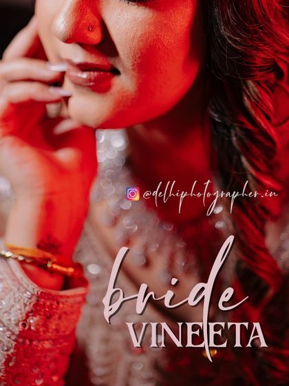 A close-up, artistic shot focusing on the bride's lips and henna-adorned hand. This type of detail shot adds a modern and stylish element to the wedding album.