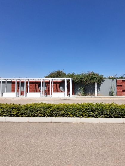 A view from across the road at Aamby City, showing the hedge planting that has been completed.