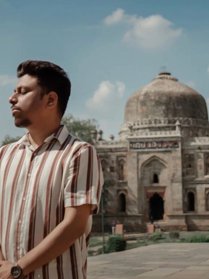 A solo portrait of the groom against the backdrop of a historic Delhi tomb. We make sure to capture individual portraits that reflect each person's personality during the shoot.