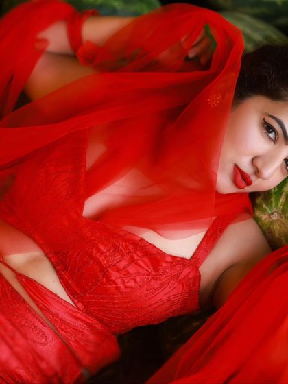 A creative and vibrant summer-themed shoot with an actress in a red outfit surrounded by watermelons. This series is playful and colorful, perfect for a brand campaign or a unique portfolio piece.