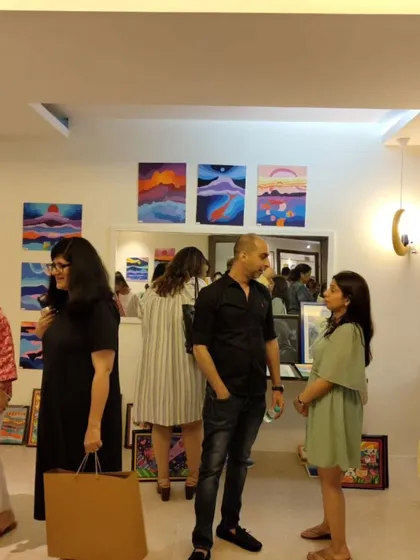 Guests mingle and discuss the art during our 30th-anniversary celebration. The event brings together people from our community for an evening of inspiration and connection.