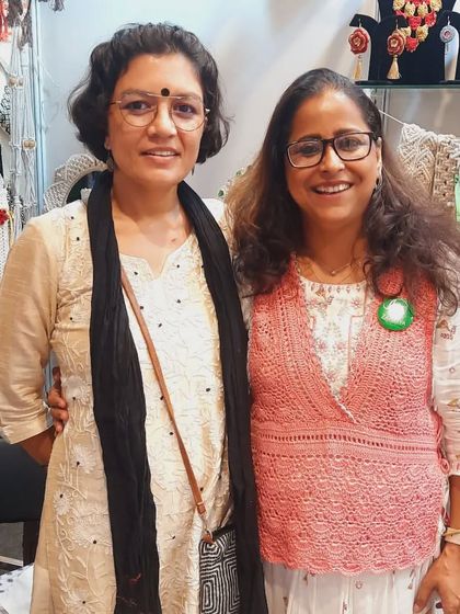 Sharing a moment with a visitor at our exhibition stall. These offline events are so important for connecting with people and getting direct appreciation for our handmade crochet and macrame products.