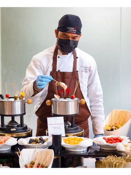 Our interactive fondue station is a fun and social dining experience. A chef assists guests as they dip fruits, marshmallows, and cakes into pots of melted dark and white chocolate, perfect for brunches and cocktail parties.