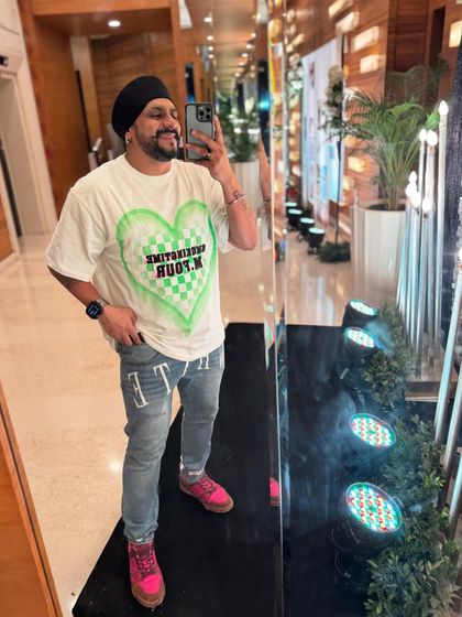 A quick mirror selfie before a Friday night gig. The heart on the shirt matches the love in the air at a wedding.