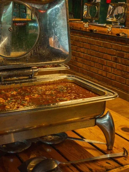A steaming hot tray of Chicken Do Pyaza, a favorite from my non-veg buffet selection.