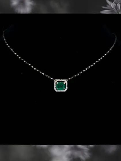 A duplicate image of the emerald gemstone mangalsutra. This piece is a perfect example of how we incorporate personal style into traditional jewellery.
