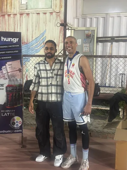A player from the winning team stands proud after the prize ceremony. Our events are a great platform for individual players to shine.