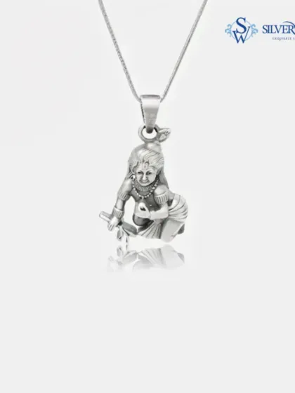 My Bal Gopal silver pendant, spiritually carved from 92.5 silver. This piece is perfect for daily wear, keeping a symbol of divinity close to your heart. The delicate chain complements the detailed craftsmanship of the pendant.